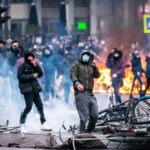 Hollanda’da Covid-19 önlemleri protestosu büyüyor: Rotterdam’da OHAL ilan edildi